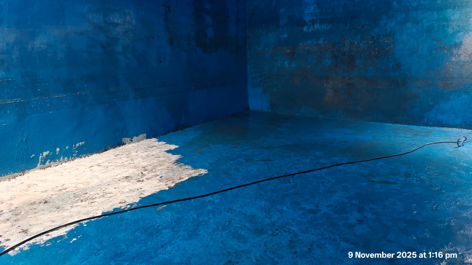 Sparkling clean overhead blue plastic tank