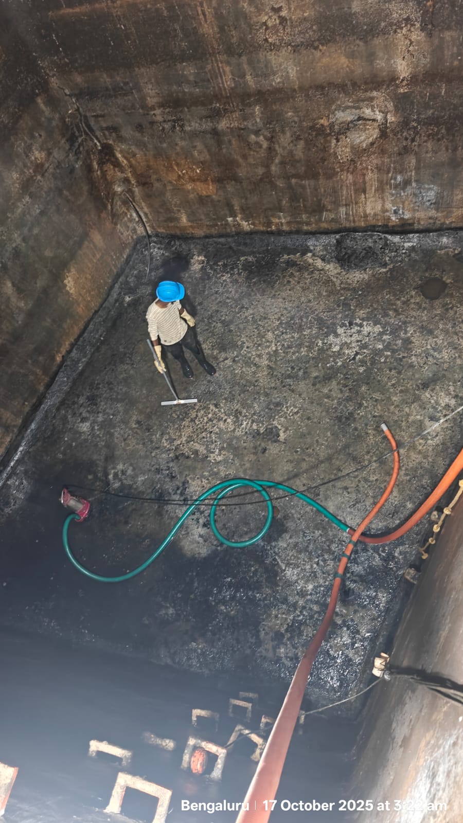 Stained tiled water tank floor